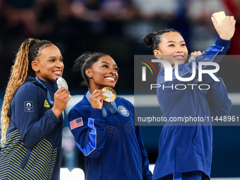 Silver medalist Rebeca Andrade of Team Brazil (L)  Gold medalist and winner Simone Biles (C)  of USA and bronze medalist Suni Lee of USA  ar...