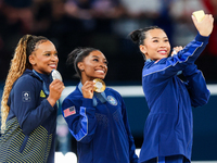 Silver medalist Rebeca Andrade of Team Brazil (L)  Gold medalist and winner Simone Biles (C)  of USA and bronze medalist Suni Lee of USA  ar...