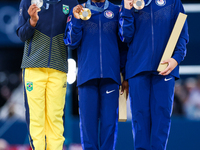 Silver medalist Rebeca Andrade of Team Brazil (L)  Gold medalist and winner Simone Biles (C)  of USA and bronze medalist Suni Lee of USA  ar...