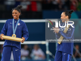  Gold medalist and winner Simone Biles  of USA and bronze medalist Suni Lee of USA  are posing  during the Artistic Gymnastics Women's All-A...