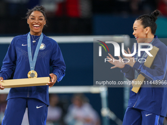  Gold medalist and winner Simone Biles  of USA and bronze medalist Suni Lee of USA  are posing  during the Artistic Gymnastics Women's All-A...