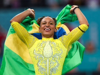 Rebeca Andrade celebrates victory with the Brazilian  flag while the women's final all-round competition on day six of the Olympic Games Par...