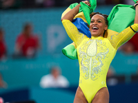 Rebeca Andrade celebrates victory with the Brazilian  flag while the women's final all-round competition on day six of the Olympic Games Par...