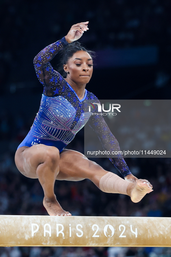 Simone Biles of Team United States competes on the balance beam during the Artistic Gymnastics Women's All-Around Final on day six of the Ol...