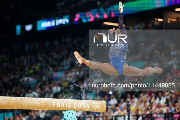 Simone Biles of Team United States competes on the balance beam during the Artistic Gymnastics Women's All-Around Final on day six of the Ol...