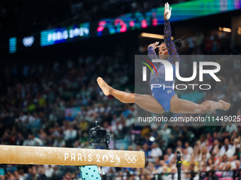 Simone Biles of Team United States competes on the balance beam during the Artistic Gymnastics Women's All-Around Final on day six of the Ol...