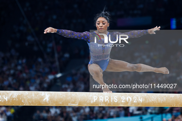 Simone Biles of Team United States competes on the balance beam during the Artistic Gymnastics Women's All-Around Final on day six of the Ol...