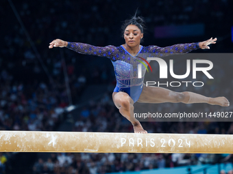 Simone Biles of Team United States competes on the balance beam during the Artistic Gymnastics Women's All-Around Final on day six of the Ol...