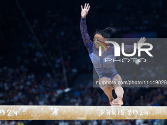 Simone Biles of Team United States competes on the balance beam during the Artistic Gymnastics Women's All-Around Final on day six of the Ol...