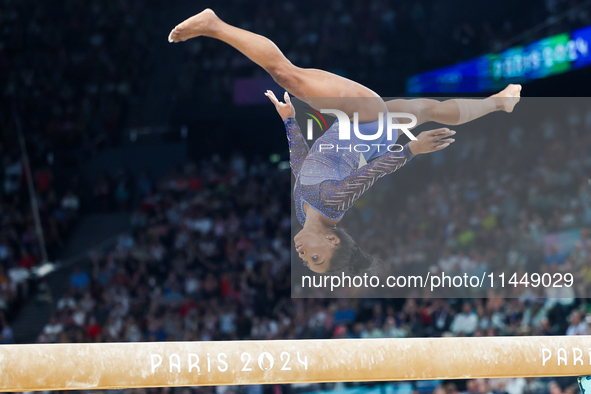 Simone Biles of Team United States competes on the balance beam during the Artistic Gymnastics Women's All-Around Final on day six of the Ol...