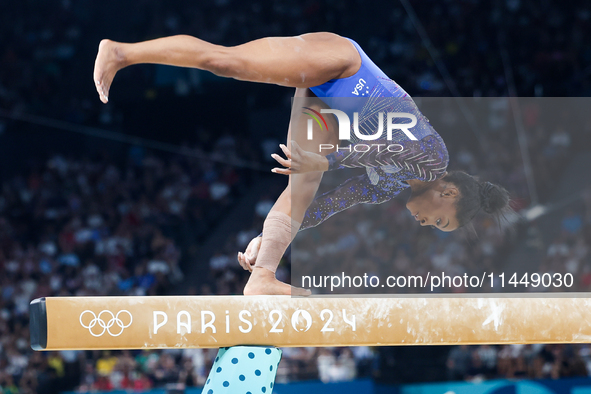 Simone Biles of Team United States competes on the balance beam during the Artistic Gymnastics Women's All-Around Final on day six of the Ol...