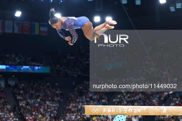 Simone Biles of Team United States competes on the balance beam during the Artistic Gymnastics Women's All-Around Final on day six of the Ol...