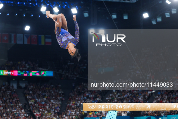 Simone Biles of Team United States competes on the balance beam during the Artistic Gymnastics Women's All-Around Final on day six of the Ol...