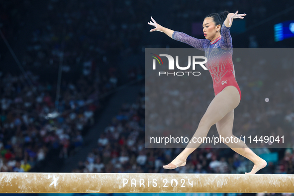 Sunisa Lee of Team United States competes on the balance beam during the Artistic Gymnastics Women's All-Around Final on day six of the Olym...