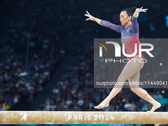 Sunisa Lee of Team United States competes on the balance beam during the Artistic Gymnastics Women's All-Around Final on day six of the Olym...