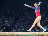 Sunisa Lee of Team United States competes on the balance beam during the Artistic Gymnastics Women's All-Around Final on day six of the Olym...