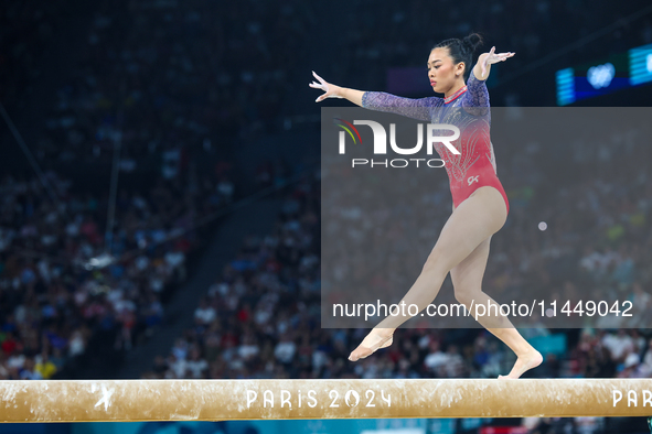 Sunisa Lee of Team United States competes on the balance beam during the Artistic Gymnastics Women's All-Around Final on day six of the Olym...