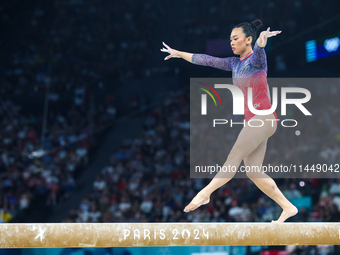 Sunisa Lee of Team United States competes on the balance beam during the Artistic Gymnastics Women's All-Around Final on day six of the Olym...