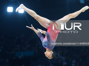 Sunisa Lee of Team United States competes on the balance beam during the Artistic Gymnastics Women's All-Around Final on day six of the Olym...