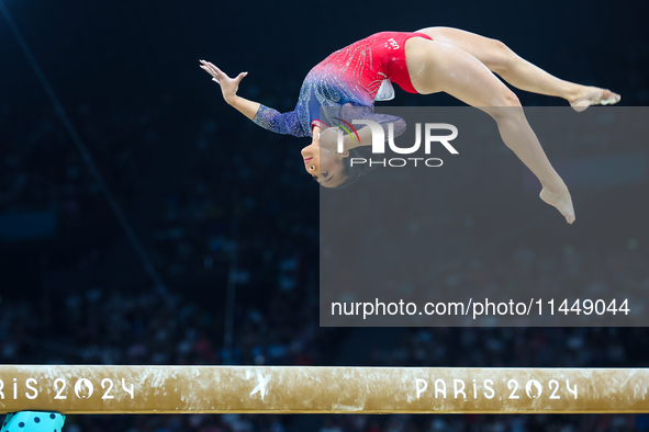 Sunisa Lee of Team United States competes on the balance beam during the Artistic Gymnastics Women's All-Around Final on day six of the Olym...