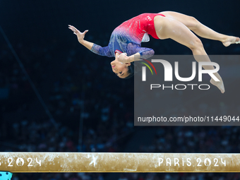 Sunisa Lee of Team United States competes on the balance beam during the Artistic Gymnastics Women's All-Around Final on day six of the Olym...