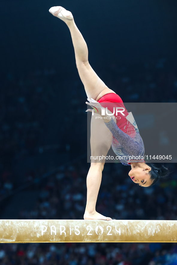 Sunisa Lee of Team United States competes on the balance beam during the Artistic Gymnastics Women's All-Around Final on day six of the Olym...