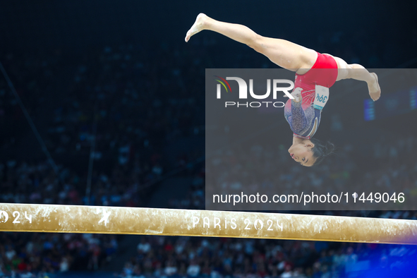 Sunisa Lee of Team United States competes on the balance beam during the Artistic Gymnastics Women's All-Around Final on day six of the Olym...