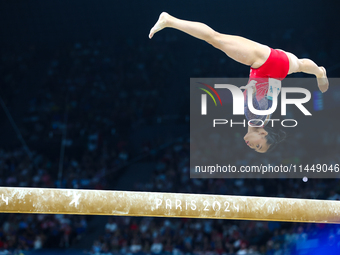 Sunisa Lee of Team United States competes on the balance beam during the Artistic Gymnastics Women's All-Around Final on day six of the Olym...