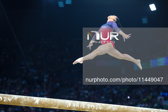 Sunisa Lee of Team United States competes on the balance beam during the Artistic Gymnastics Women's All-Around Final on day six of the Olym...