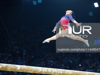 Sunisa Lee of Team United States competes on the balance beam during the Artistic Gymnastics Women's All-Around Final on day six of the Olym...