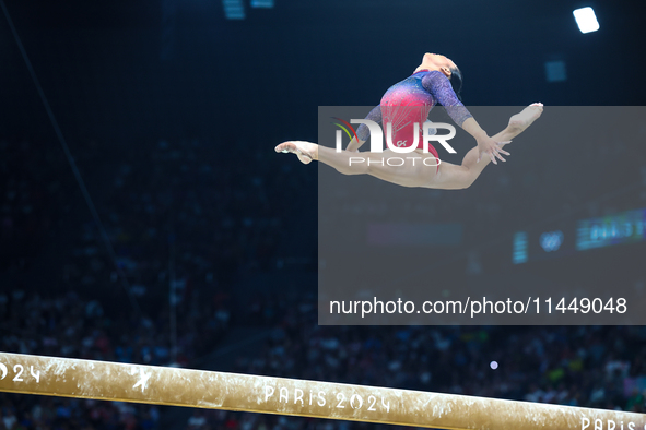 Sunisa Lee of Team United States competes on the balance beam during the Artistic Gymnastics Women's All-Around Final on day six of the Olym...