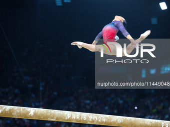 Sunisa Lee of Team United States competes on the balance beam during the Artistic Gymnastics Women's All-Around Final on day six of the Olym...