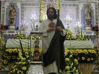 People are viewing an image of Saint Jude Thaddeus at the Church of San Hipolito in Mexico City, Mexico, on August 1, 2024 where dozens of p...