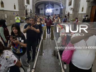 Dozens of people are attending the Church of San Hipolito in Mexico City, Mexico, on August 1, 2024 to see the relics of Saint Jude Thaddeus...