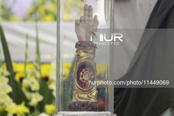 People are viewing the relics of Saint Jude Thaddeus at the Church of San Hipolito in Mexico City, Mexico, on August 1, 2024 where dozens of...