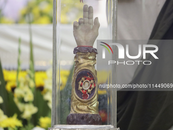 People are viewing the relics of Saint Jude Thaddeus at the Church of San Hipolito in Mexico City, Mexico, on August 1, 2024 where dozens of...