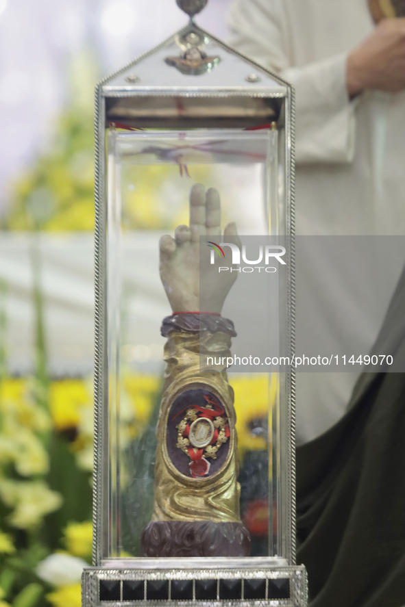 People are viewing the relics of Saint Jude Thaddeus at the Church of San Hipolito in Mexico City, Mexico, on August 1, 2024 where dozens of...