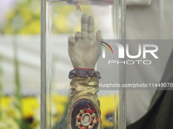 People are viewing the relics of Saint Jude Thaddeus at the Church of San Hipolito in Mexico City, Mexico, on August 1, 2024 where dozens of...