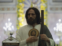 People are viewing an image of Saint Jude Thaddeus at the Church of San Hipolito in Mexico City, Mexico, on August 1, 2024 where dozens of p...