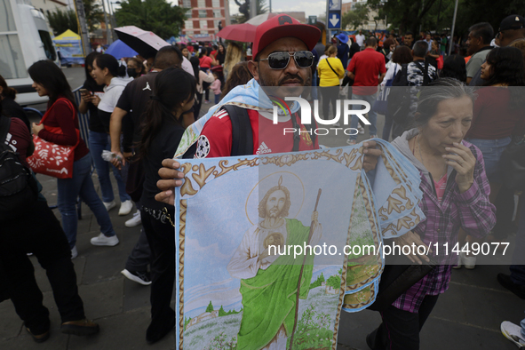 People are selling Saint Jude Thaddeus items outside the Church of San Hipolito in Mexico City, Mexico, on August 1, 2024 where dozens of pe...