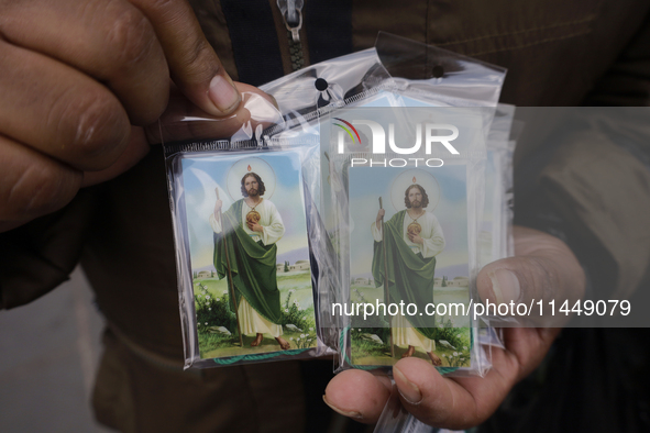 People are selling Saint Jude Thaddeus items outside the Church of San Hipolito in Mexico City, Mexico, on August 1, 2024 where dozens of pe...