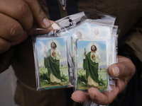 People are selling Saint Jude Thaddeus items outside the Church of San Hipolito in Mexico City, Mexico, on August 1, 2024 where dozens of pe...