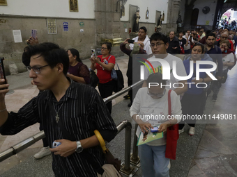 Dozens of people are attending the Church of San Hipolito in Mexico City, Mexico, on August 1, 2024 to see the relics of Saint Jude Thaddeus...