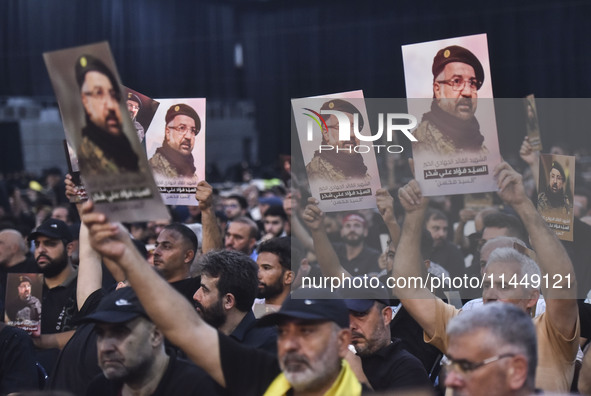 Hezbollah fighters and mourners are attending the funeral ceremony of slain top commander Fuad Shukr in Beirut's southern suburbs, on August...