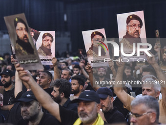 Hezbollah fighters and mourners are attending the funeral ceremony of slain top commander Fuad Shukr in Beirut's southern suburbs, on August...