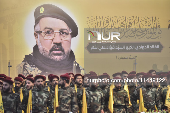 Hezbollah fighters and mourners are attending the funeral ceremony of slain top commander Fuad Shukr in Beirut's southern suburbs, on August...