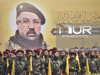 Hezbollah fighters and mourners are attending the funeral ceremony of slain top commander Fuad Shukr in Beirut's southern suburbs, on August...