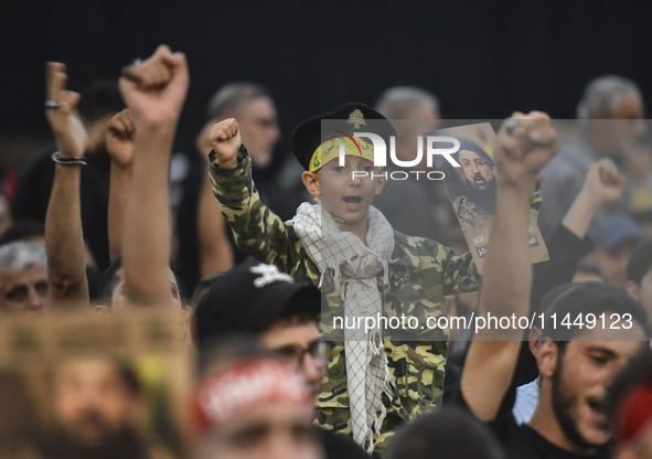 Hezbollah fighters and mourners are attending the funeral ceremony of slain top commander Fuad Shukr in Beirut's southern suburbs, on August...