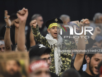 Hezbollah fighters and mourners are attending the funeral ceremony of slain top commander Fuad Shukr in Beirut's southern suburbs, on August...