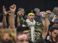 Hezbollah fighters and mourners are attending the funeral ceremony of slain top commander Fuad Shukr in Beirut's southern suburbs, on August...